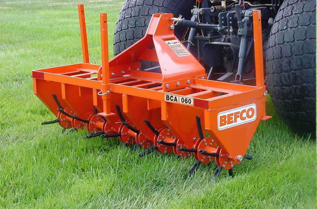 Tractor-mounted BEFCO aeration implement for lawn care