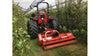 Tractor operating a BEFCO Destroyer D90 flail shredder in orchard rows using offset mowing to manage grass, brush, and pruning debris