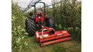 Tractor operating a BEFCO Destroyer D90 flail shredder in orchard rows using offset mowing to manage grass, brush, and pruning debris